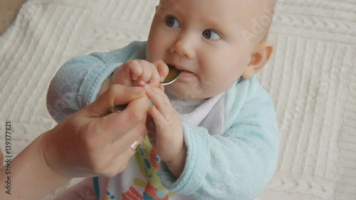 Closeup shot of baby eating first food