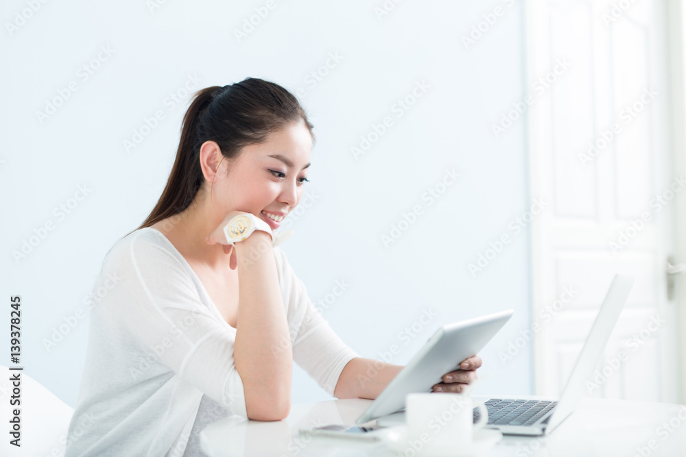 young pretty woman using laptop in office young pretty woman using laptop in office