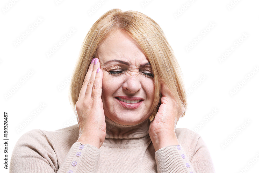 Senior woman suffering from headache on white background Senior woman suffering from headache on white background