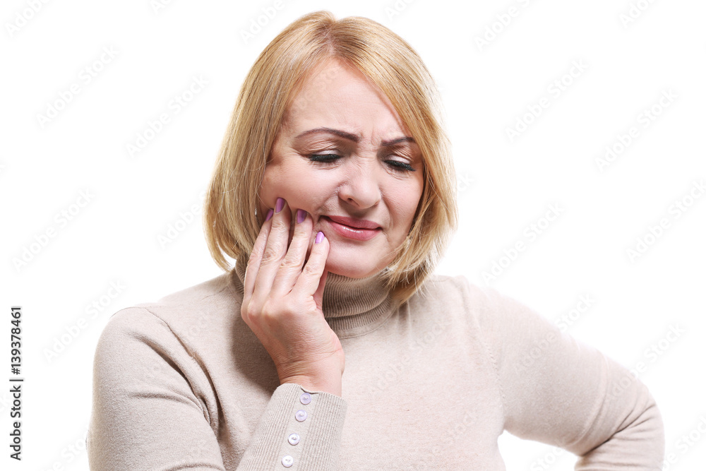 Senior woman suffering from toothache on white background Senior woman suffering from toothache on white background