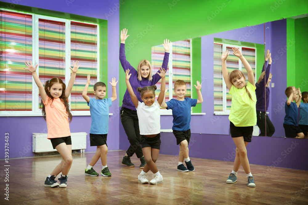 Fototapeta premium Dance teacher and children in choreography class
