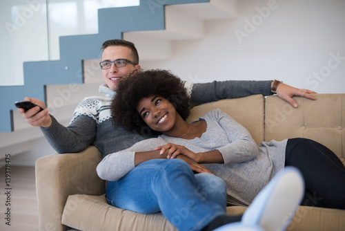 multiethnic couple relaxing at home