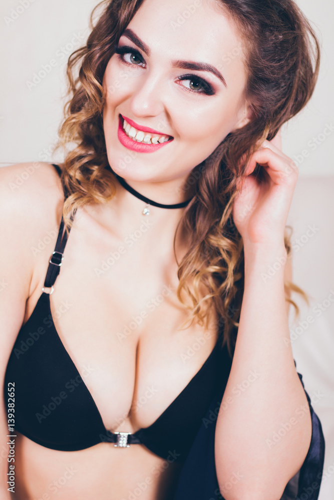 Sexy beautiful girl in lingerie on a leather sofa Sexy beautiful girl in lingerie on a leather sofa