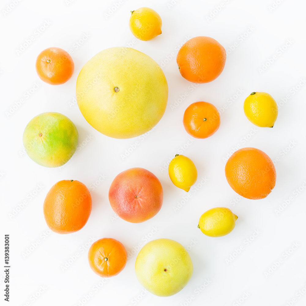 Citrus fruits pattern made of lemon, orange, grapefruit, sweetie and pomelo on white background. Flat lay, top view. Fruit background Citrus fruits pattern made of lemon, orange, grapefruit, sweetie and pomelo on white background. Flat lay, top view. Fruit background
