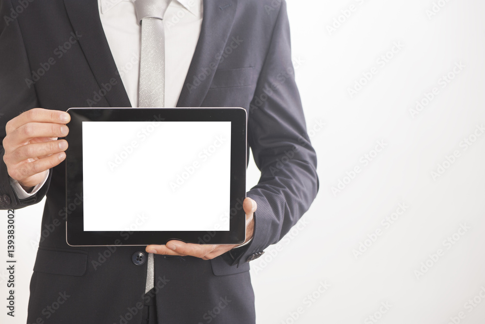 Businessman holding blank digital tablet, isolated on white background Businessman holding blank digital tablet, isolated on white background