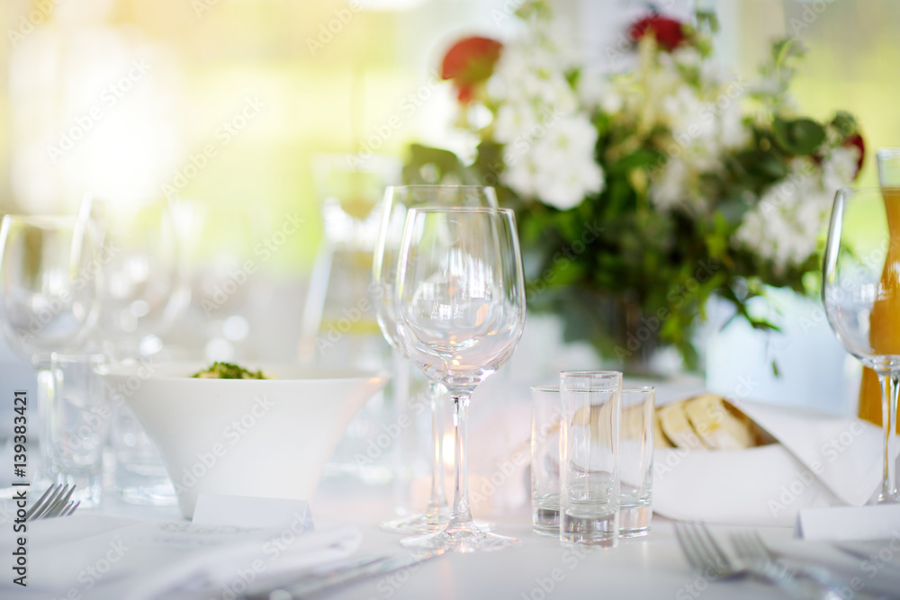 Beautiful table setting with crockery and flowers for a party, wedding reception or other festive event