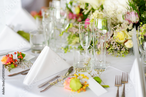 Beautiful table setting with crockery and flowers for a party, wedding reception or other festive event