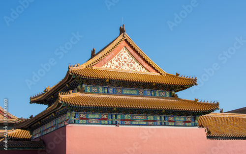 Forbidden city rooftop against blue sky