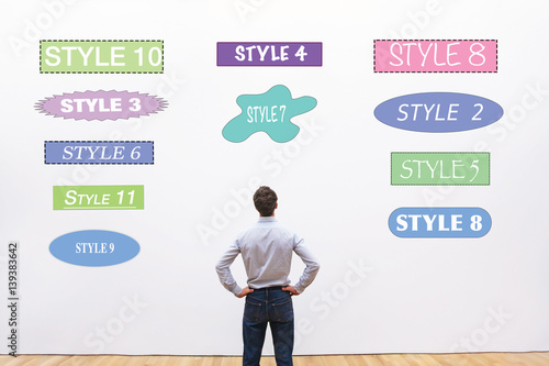 Valokuvatapetti designer choosing style, fonts, shapes and colors  for design