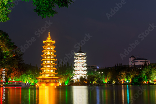 Two towers in Guilin China at night photo