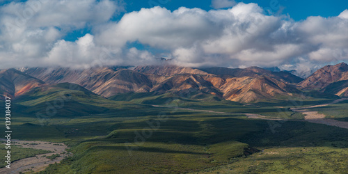 Panorama of Mountains  Sky and Green Plains in Alaska