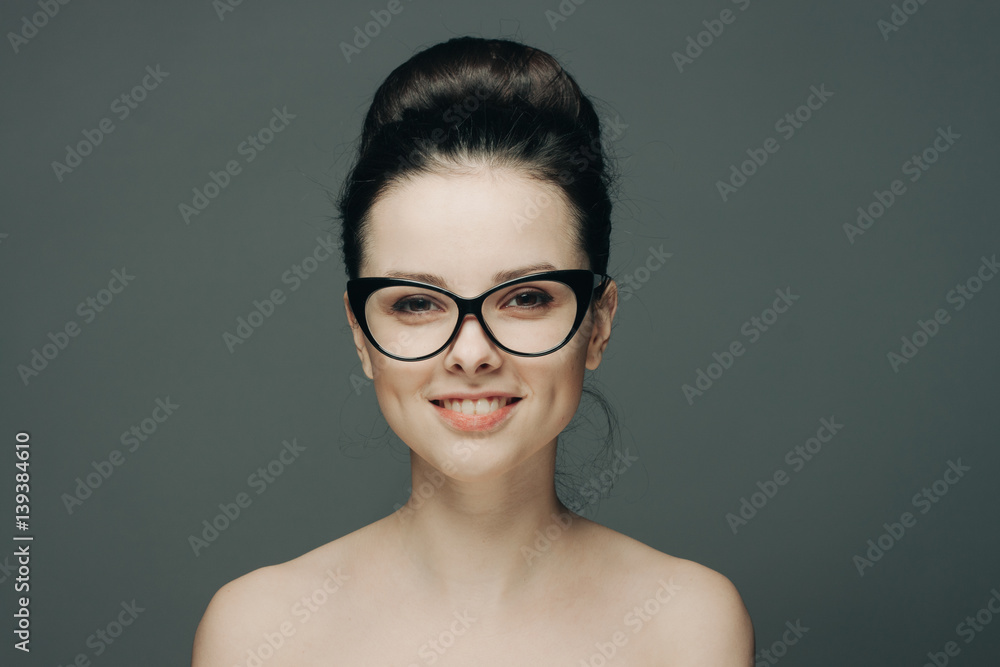 attractive woman with a beautiful smile in black glasses attractive woman with a beautiful smile in black glasses
