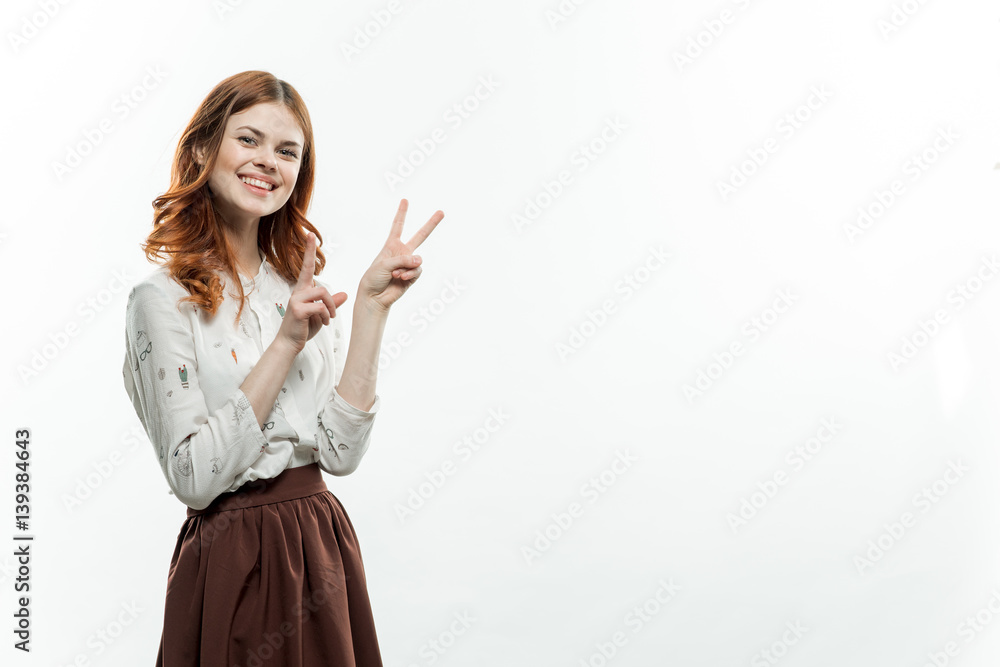 beautiful woman shows two fingers in the camera, free place beautiful woman shows two fingers in the camera, free place