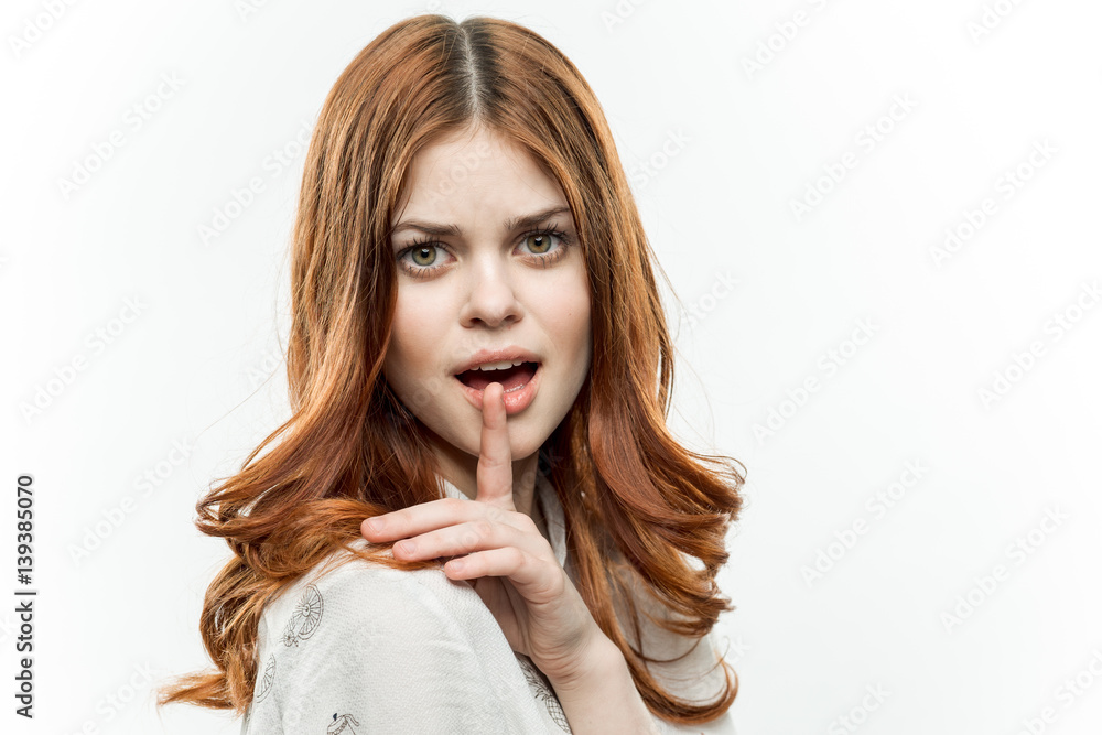 finger near the open mouth of a woman, emotions finger near the open mouth of a woman, emotions