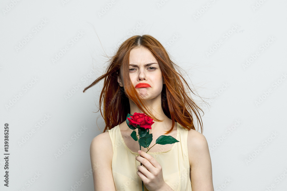 frustrated woman with a flower in her hand frustrated woman with a flower in her hand
