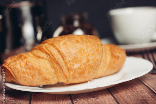 sweets, coffee mug tea on the table, croissant 