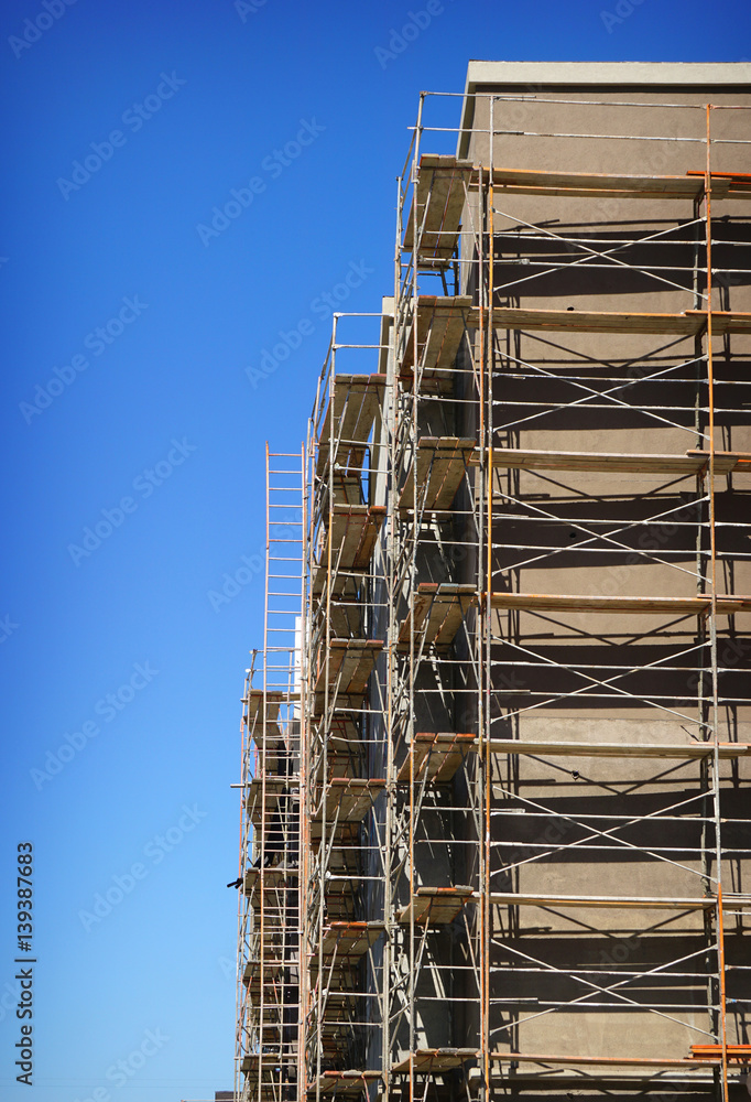 constrauction site with scaffolding on building