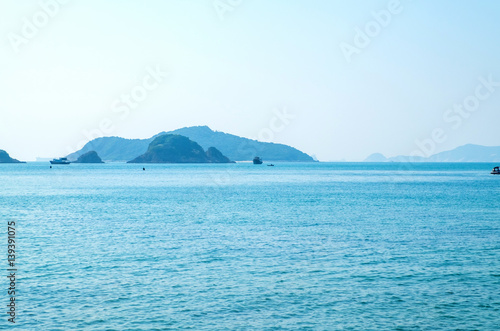 seascape view with boat and mountain view in sunny day