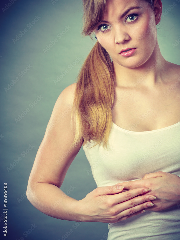 Fototapeta premium Woman suffering from sharp chest pain