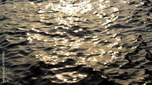 Shift focus in to out Shiny bokeh abstract background from light reflect sunset on river