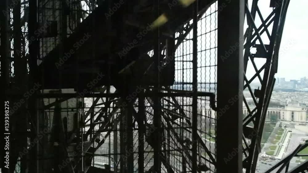 External elevator of Eiffel Tower with city view External elevator of Eiffel Tower with city view