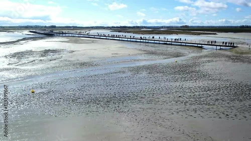 Mont Saint-Michel top view of the bridge with tourists, leading to the temple photo