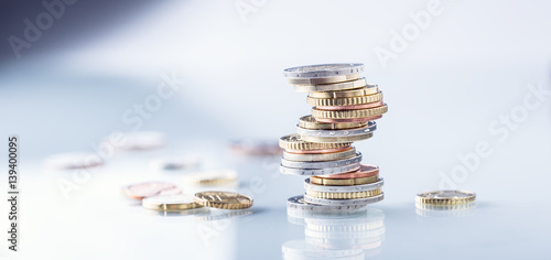 Euro coins. Euro money. Euro currency.Coins stacked on each other in different positions. Money concept. photo