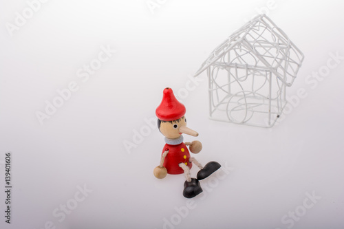 Pinocchio sitting beside a ...