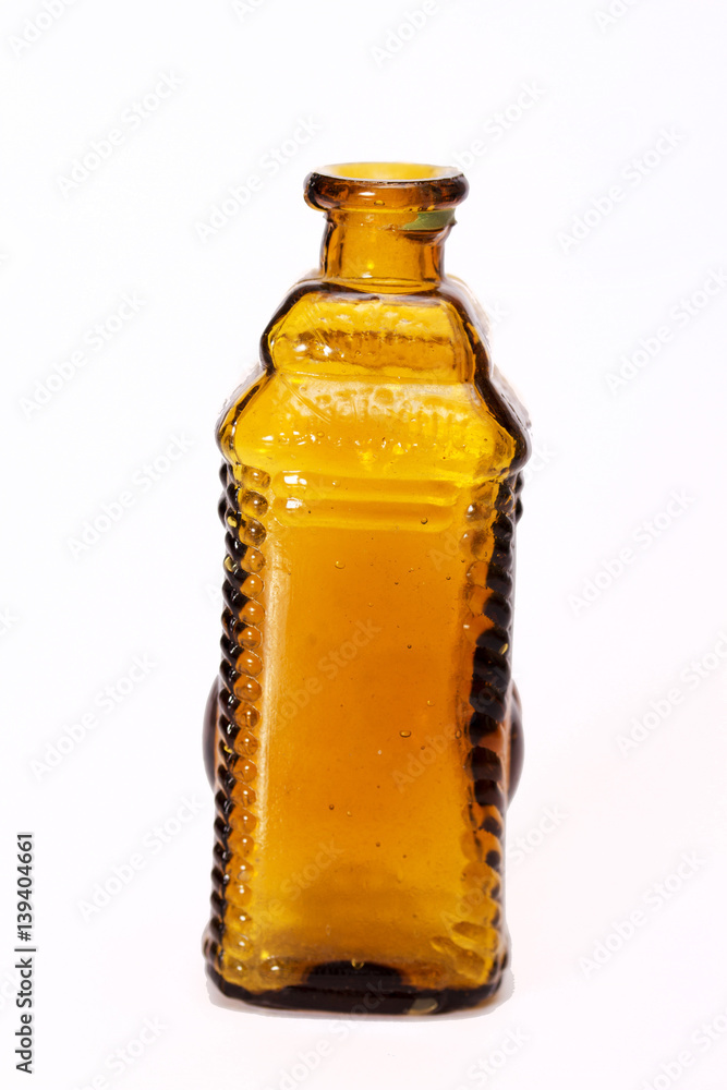 Old colourful bottles against a white background Old colourful bottles against a white background