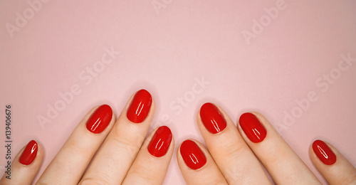 Fototapeta caucasians hands with red nails