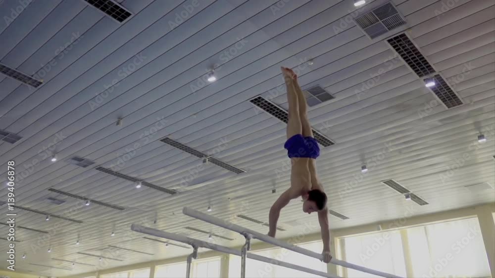 Gymnast performs routine on parallel bars HD gymnastics slowmotion