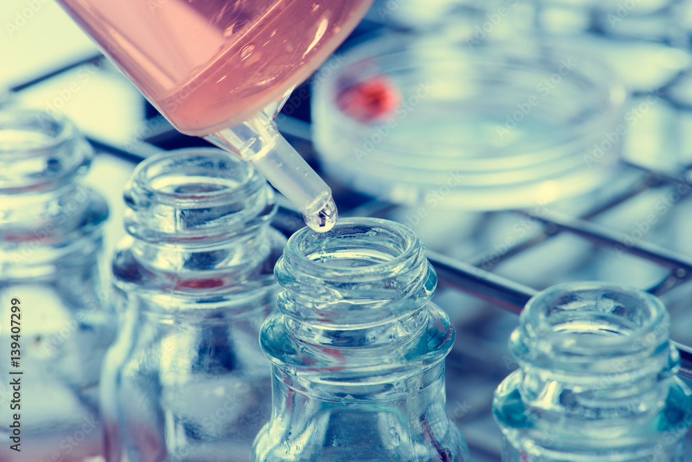 Laboratory research, dropping liquid to test tube Laboratory research, dropping liquid to test tube