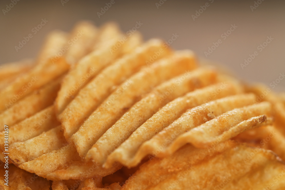 rippled potato chips with paprika closeup photo, shallow focus rippled potato chips with paprika closeup photo, shallow focus