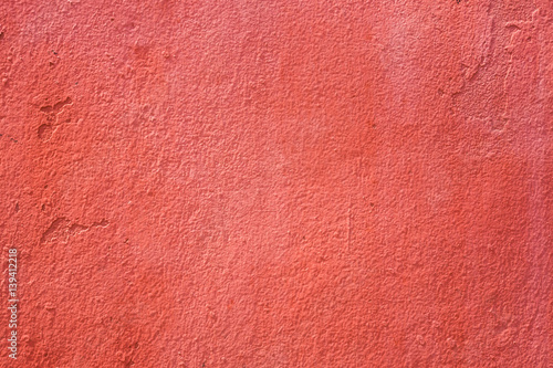 Rough red concrete wall background, texture