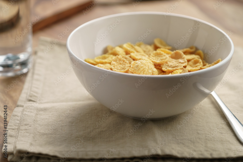 dry corn flakes for breakfast in bowl on table, breakfast preparation dry corn flakes for breakfast in bowl on table, breakfast preparation