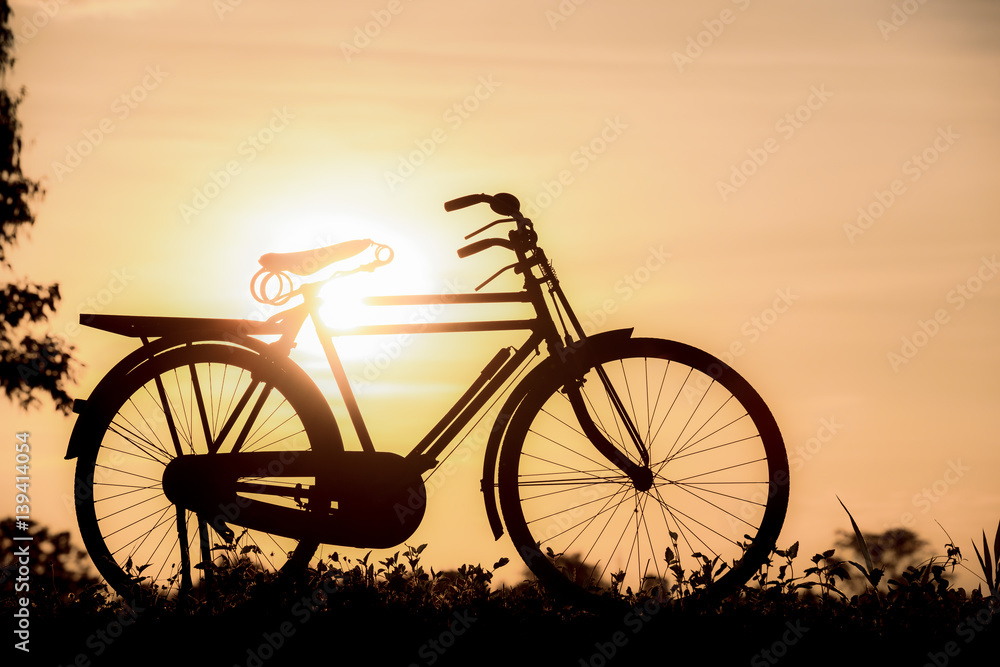 beautiful landscape image with Silhouette Bicycle at sunset beautiful landscape image with Silhouette Bicycle at sunset