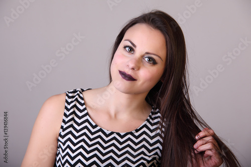 Portrait of young female beauty with long hair