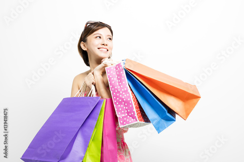 young happy smiling woman with shopping bags
