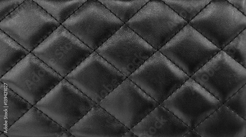 Leather texture  with seamless sewing  thread diamond square shape pattern in black color for background. © merrymuuu