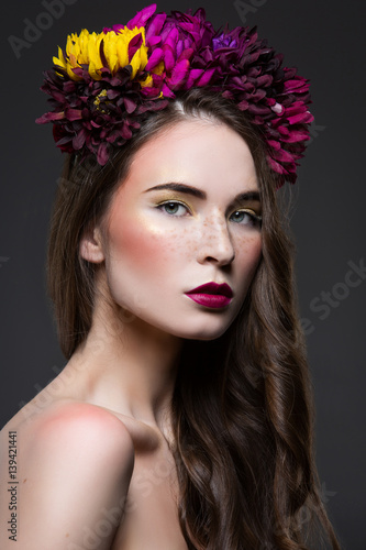 Beautiful girl with flowers on head