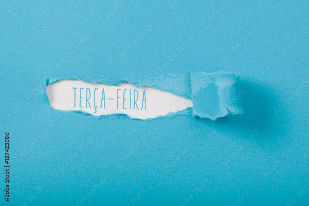 Terca-Feira (Portuguese Tuesday) weekday message on Paper torn ripped  opening Stock Photo