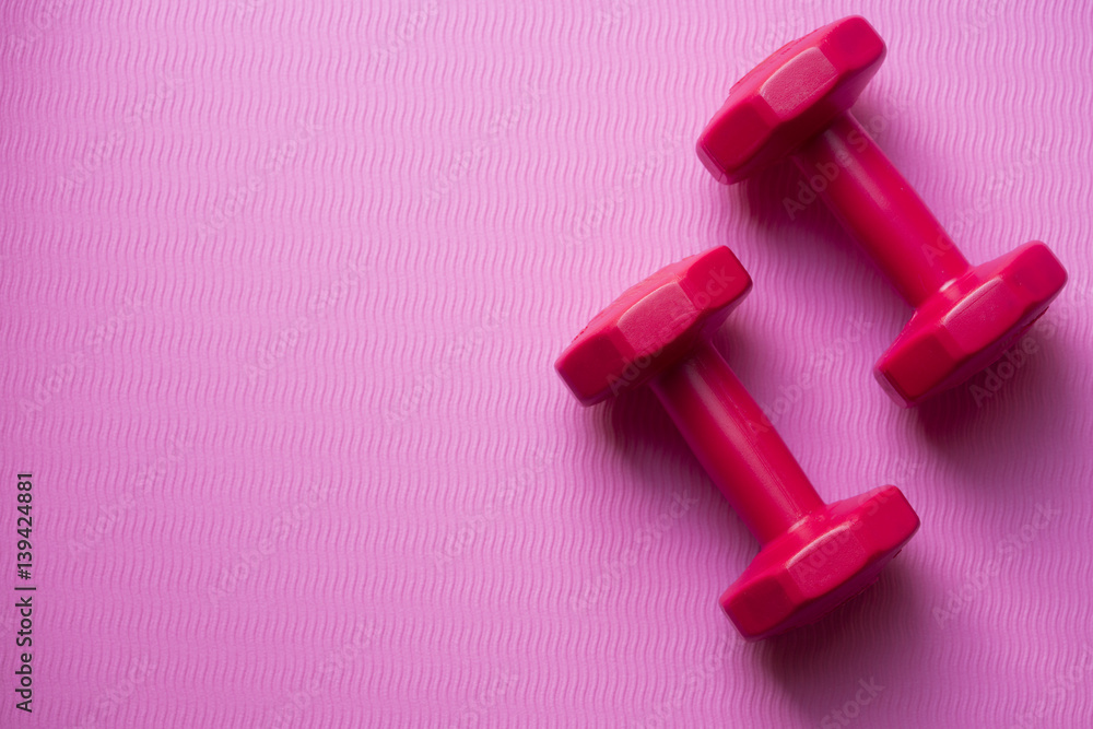 dumbbell and yoga background, top view dumbbell and yoga background, top view
