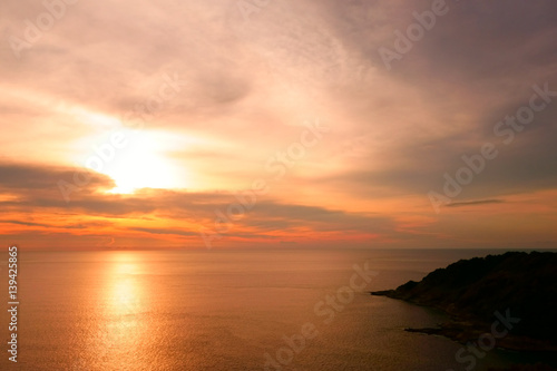 Beautiful Tropical Sunset Scene in the Sea. Phuket Lam Phromthep. Sun and Cloud Background. © asamask92