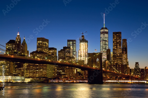 Brooklyn Bridge and New York City Manhattan skyline at dusk