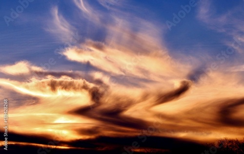 Incredible colors of ominous clouds in the desert sky at sunset in southern Arizona.