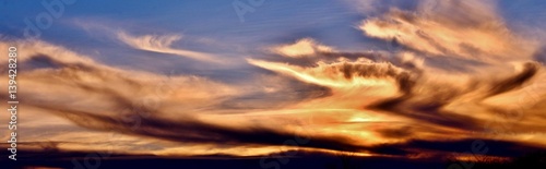 Incredible colors of ominous clouds in the desert sky at sunset in southern Arizona.