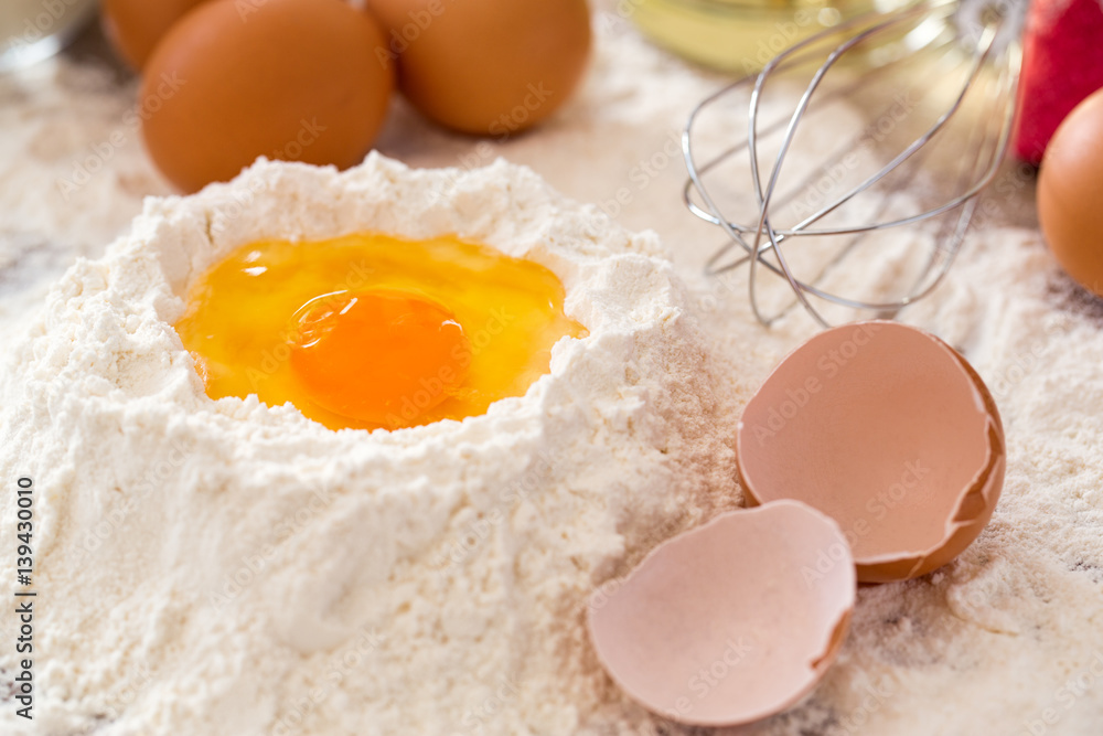 Baking ingredients -mixing egg and flour baking cakes. Baking ingredients -mixing egg and flour baking cakes.