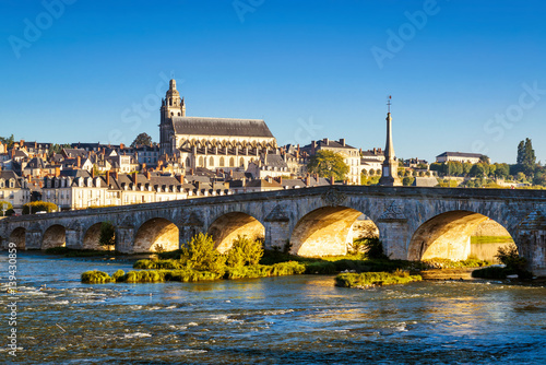 Medieval bridge over Loire river in town of Blois, France.  photo