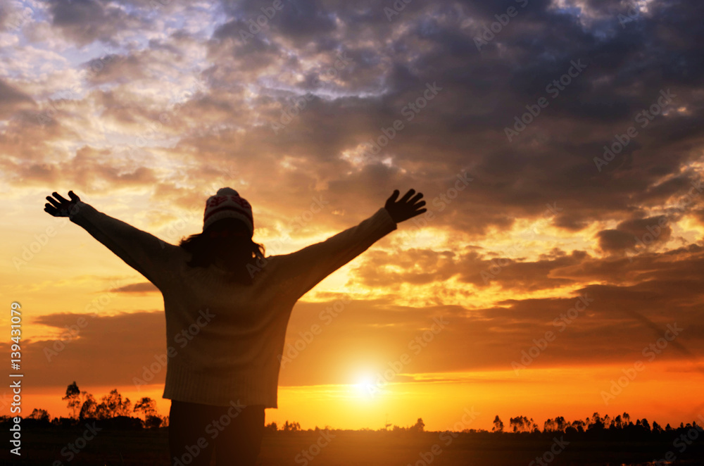 Fototapeta premium Young woman relaxing in summer sunset sky outdoor. People freedom style.