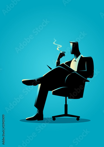 Businessman sitting and reading on a chair while smoking